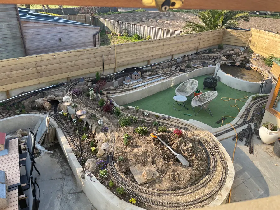 The layout under construction with track ballasted and trains testing, 2022