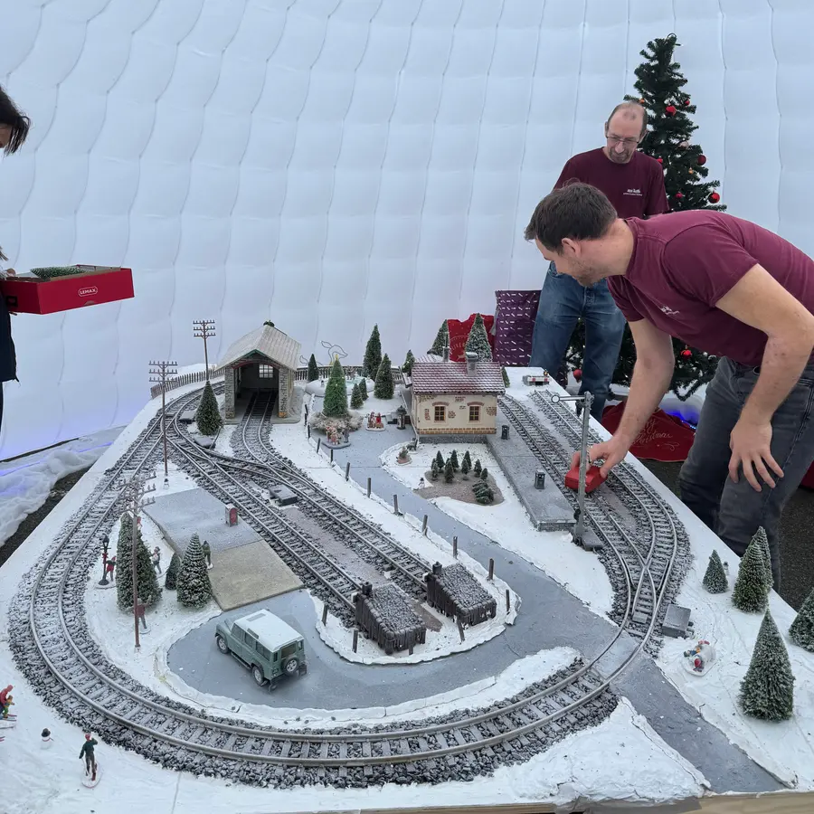 A snow-themed hands-on display layout under a marquee at the Christmas open day