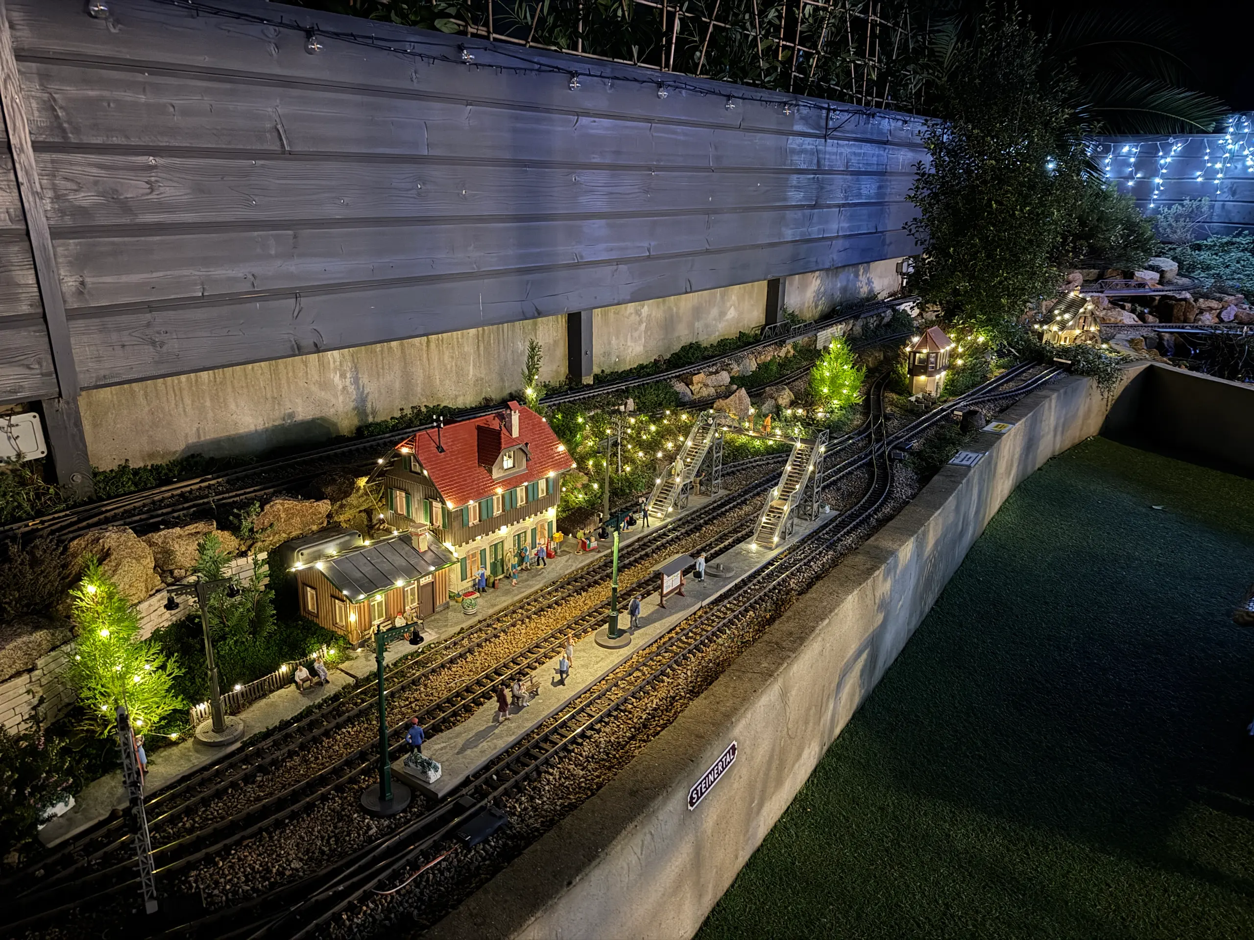 The garden railway lit up for Christmas at night