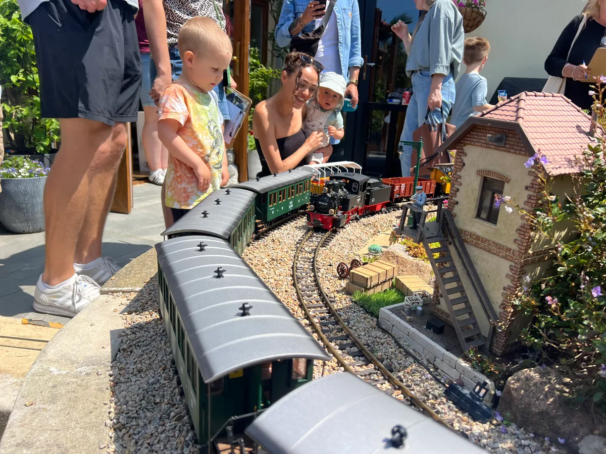 Young visitors watching the trains up close on an open day