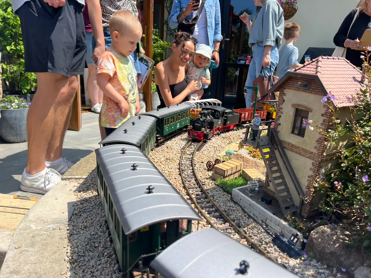 Young visitors watching the trains up close on an open day