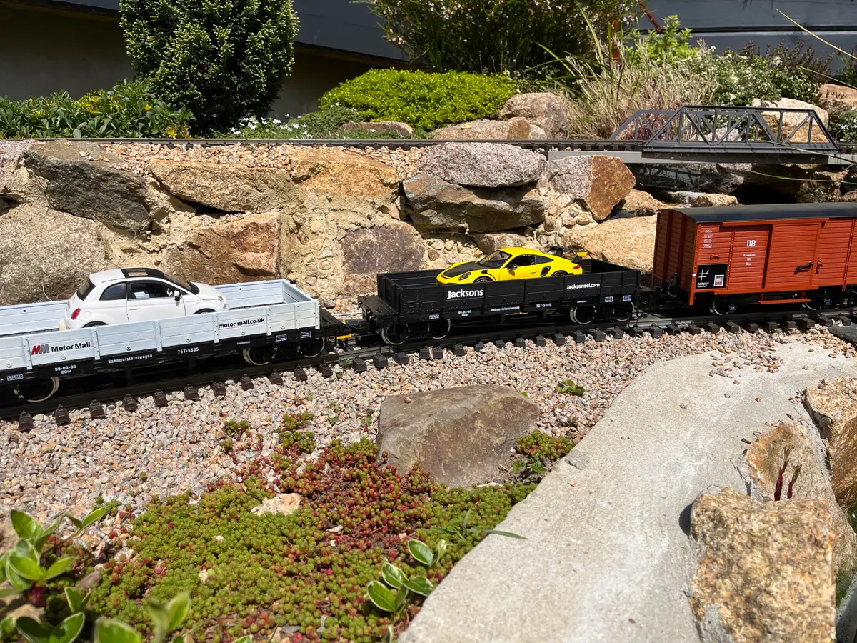 A garden railway wagon liveried for Jacksons & Motor Mall, a sponsoring business
